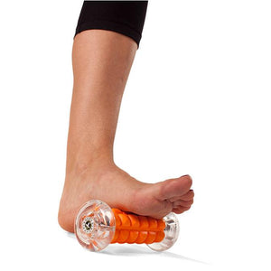 Woman using Nano Foot Roller to relax foot tissue